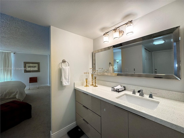 bathroom featuring vanity and a textured ceiling