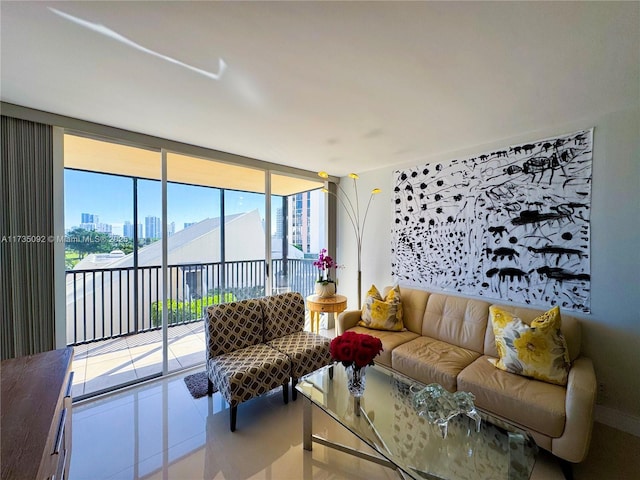 living room featuring tile patterned flooring and a wall of windows