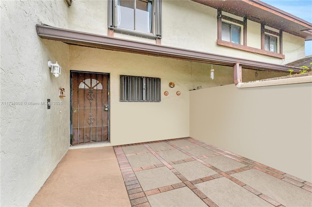 property entrance with a patio