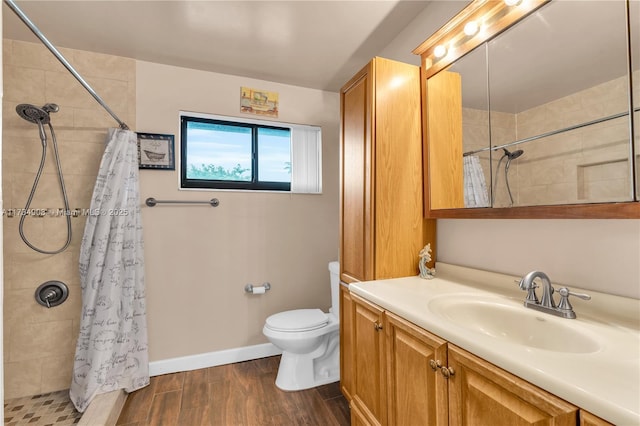 bathroom with vanity, toilet, hardwood / wood-style floors, and a shower with shower curtain