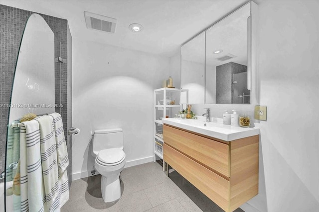 bathroom with walk in shower, vanity, and toilet