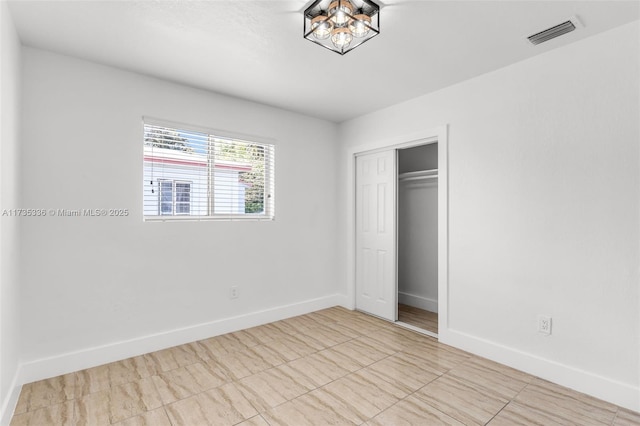 unfurnished bedroom featuring a closet