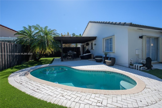 view of swimming pool with a fenced in pool, a patio, and fence