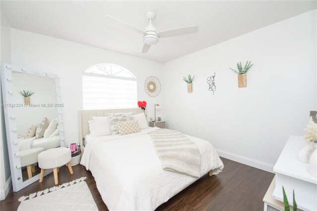 bedroom with dark hardwood / wood-style flooring