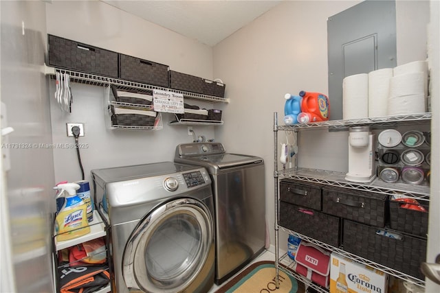 laundry room with washer and dryer and a wall mounted AC