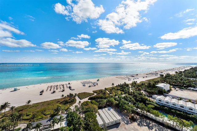 aerial view with a water view and a view of the beach