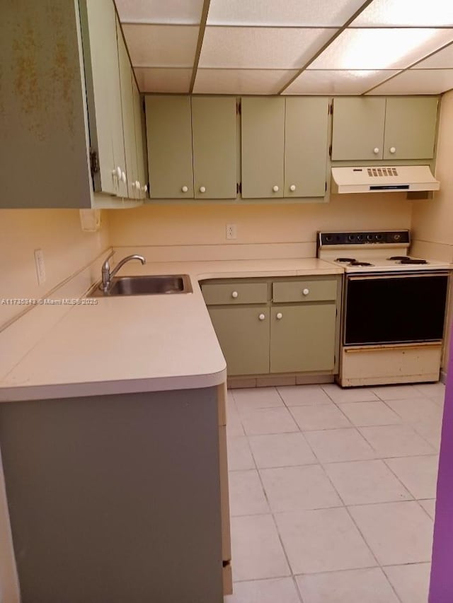 kitchen with sink, white electric range oven, and a drop ceiling