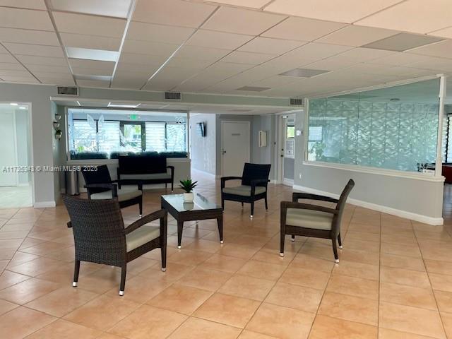 dining space with tile patterned floors and a textured ceiling