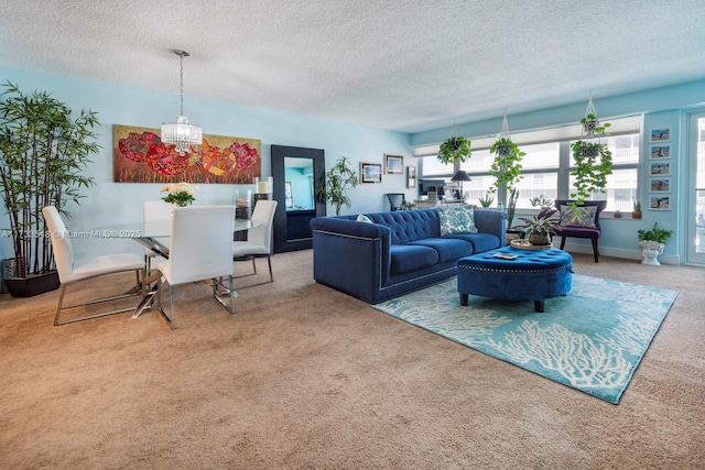 carpeted living room with a notable chandelier and a textured ceiling