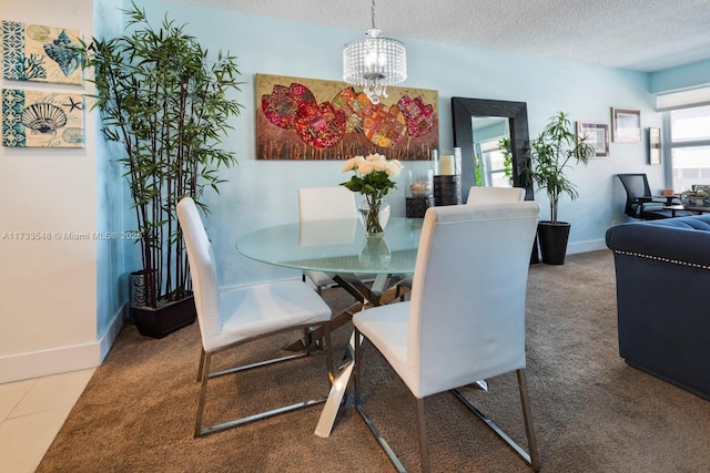 dining area featuring carpet floors, a textured ceiling, and a notable chandelier