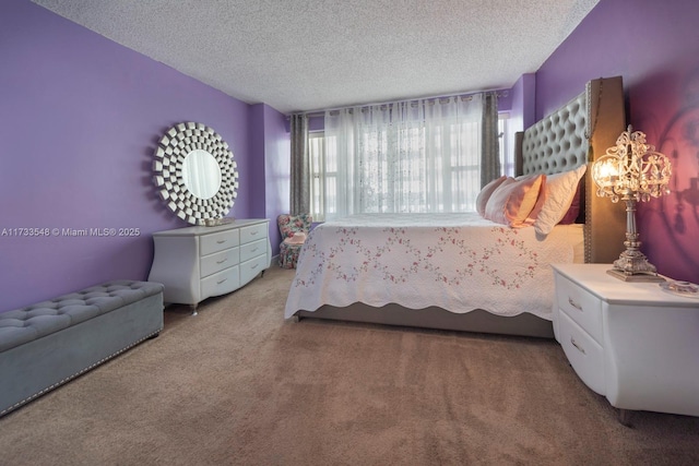 bedroom with light carpet and a textured ceiling