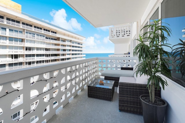 balcony featuring a water view