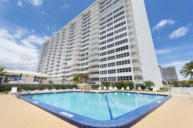 view of swimming pool with a patio