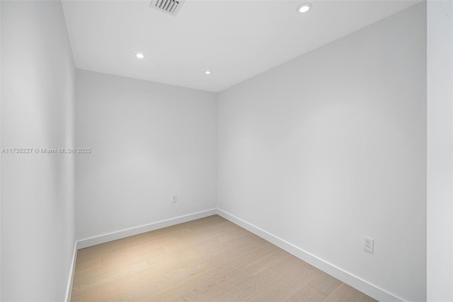 unfurnished room featuring light hardwood / wood-style floors