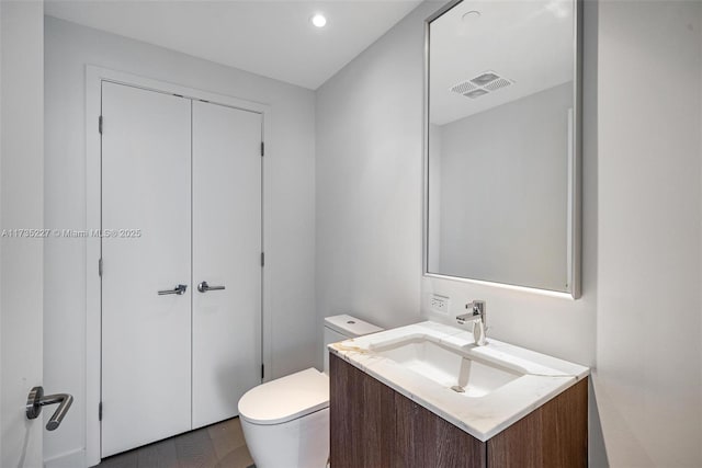 bathroom with vanity and toilet