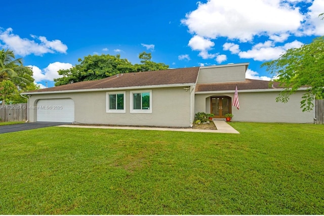 ranch-style home with a garage and a front yard