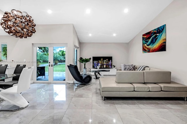 living room featuring a healthy amount of sunlight and french doors