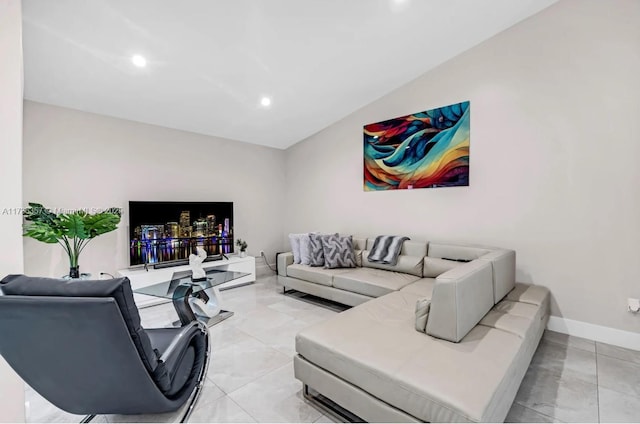 living room featuring vaulted ceiling