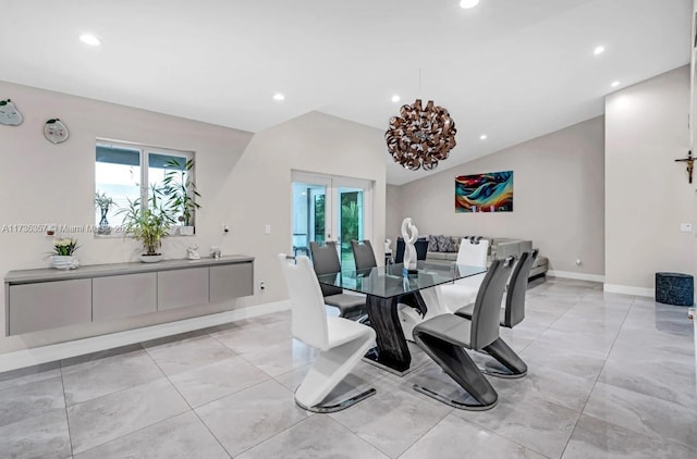 dining space with french doors, a healthy amount of sunlight, and a notable chandelier