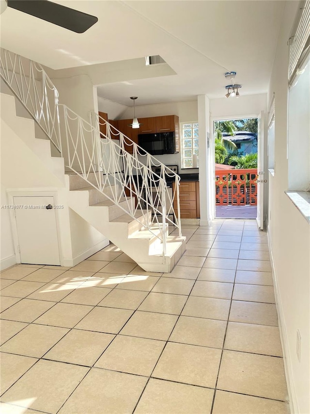 stairs with tile patterned flooring