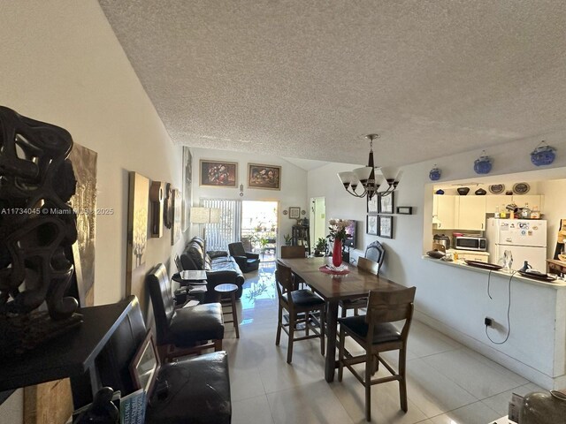 living room with lofted ceiling, a textured ceiling, and light tile patterned flooring