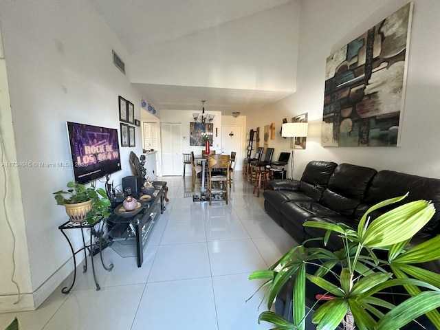 living room with light tile patterned flooring and high vaulted ceiling