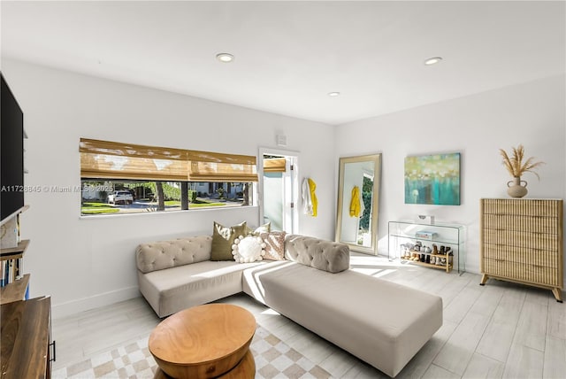 living room with recessed lighting, wood finished floors, and baseboards