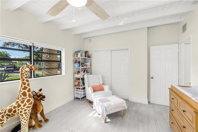 sitting room featuring wood ceiling, ceiling fan, beam ceiling, and light hardwood / wood-style floors