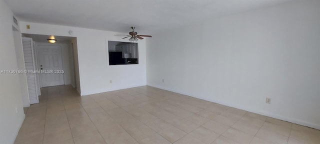 spare room with ceiling fan