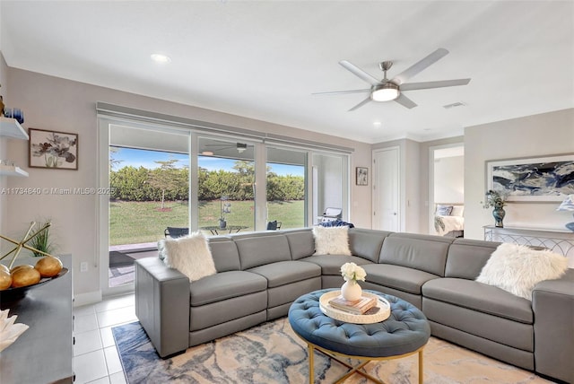 living room featuring a ceiling fan, light tile patterned flooring, recessed lighting, and baseboards