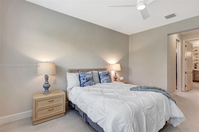 tiled bedroom featuring ceiling fan