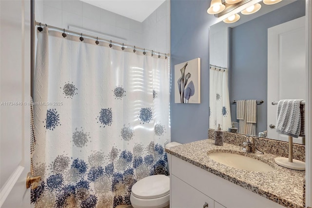 full bathroom with vanity, toilet, and a shower with curtain