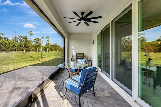 sunroom / solarium with ceiling fan