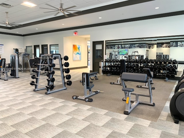 workout area with ceiling fan and a drop ceiling