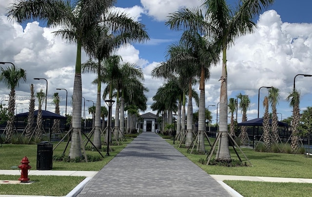 surrounding community with a gazebo and a lawn