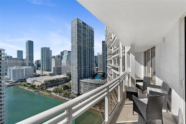 balcony featuring a water view