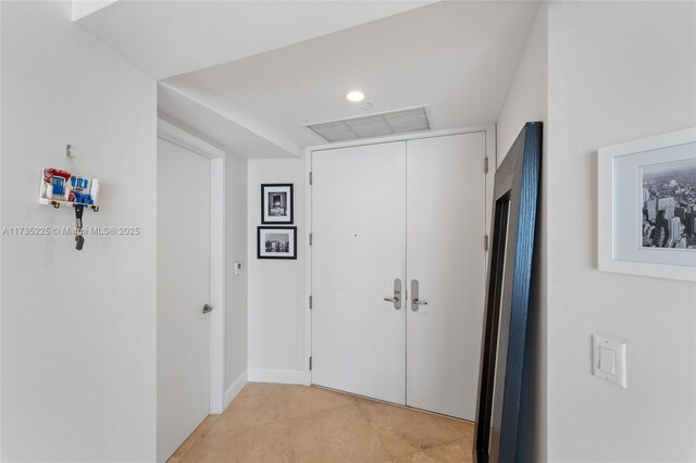 hallway featuring light tile patterned floors