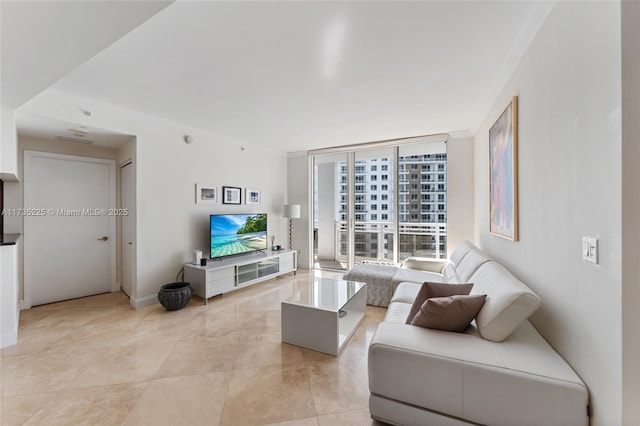 living room featuring ornamental molding, floor to ceiling windows, and light tile patterned floors