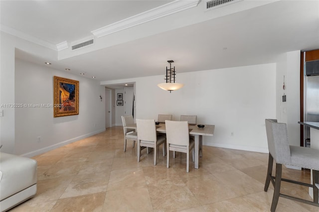 dining space featuring ornamental molding