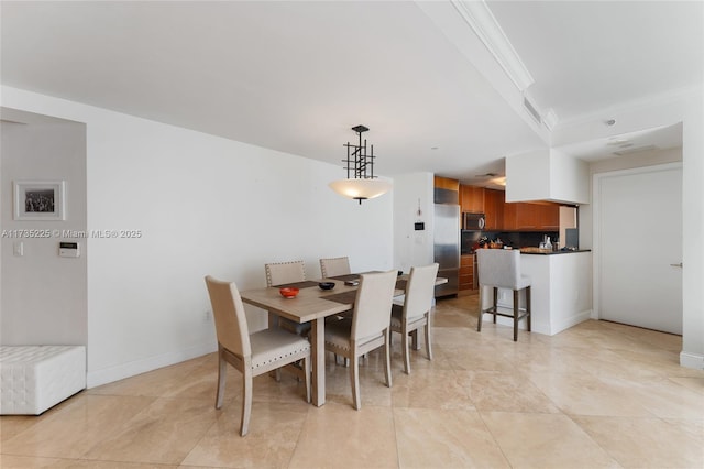 dining room featuring ornamental molding