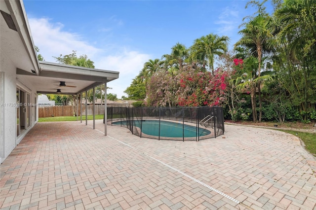 view of pool featuring ceiling fan and a patio area