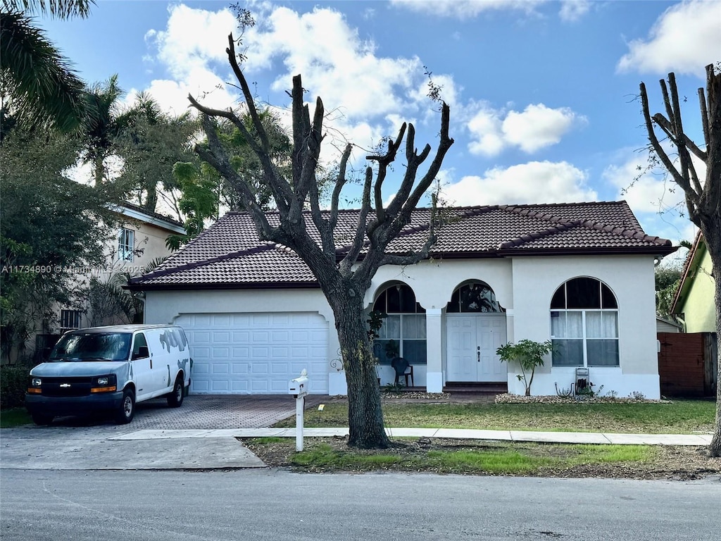 view of front of home with a garage