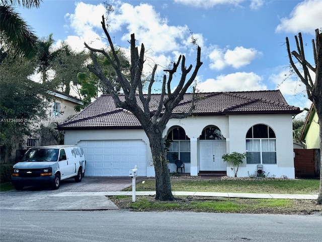 view of front of home with a garage