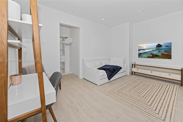 bedroom with hardwood / wood-style floors