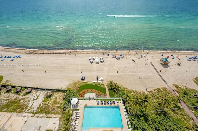 drone / aerial view featuring a water view and a beach view