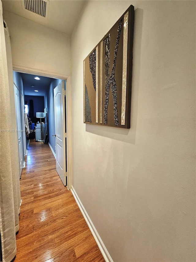 corridor featuring wood-type flooring