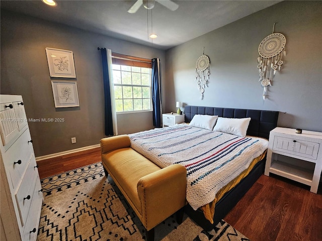 bedroom with dark hardwood / wood-style flooring