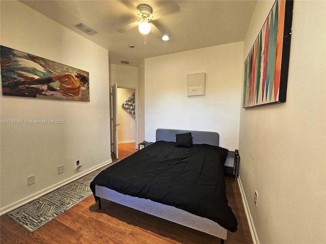 bedroom featuring dark hardwood / wood-style floors and ceiling fan