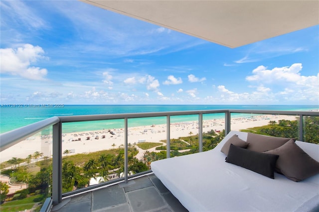 balcony with a view of the beach and a water view