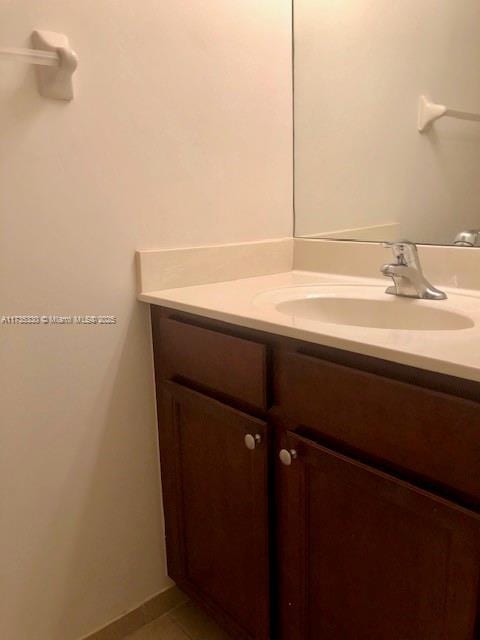 bathroom with vanity and tile patterned floors